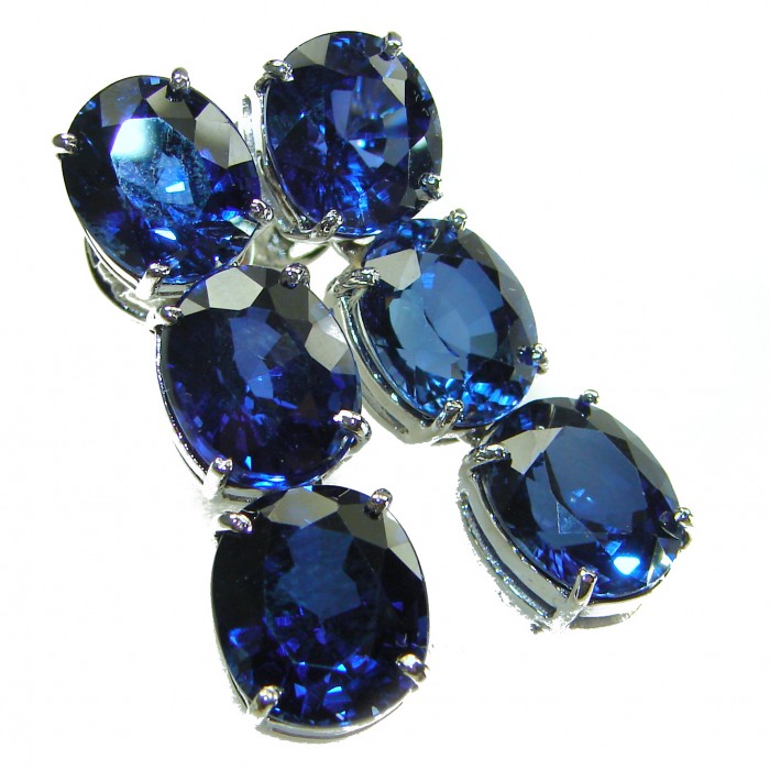 Oceania - Deep Ocean 22.5 carat London Blue Topaz .925 Sterling Silver handmade Statement earrings - Close-up of Oceania deep ocean blue topaz gemstones in silver setting