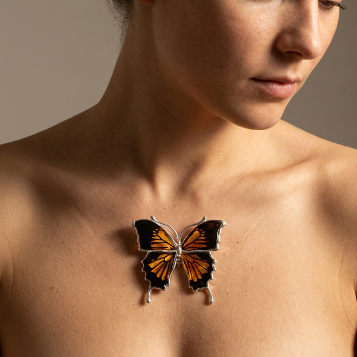 Large Golden Butterfly carved Baltic Polish Amber .925 Sterling Silver handcrafted Pendant / Brooch - Butterfly amber pendant worn on collarbone, front view.
