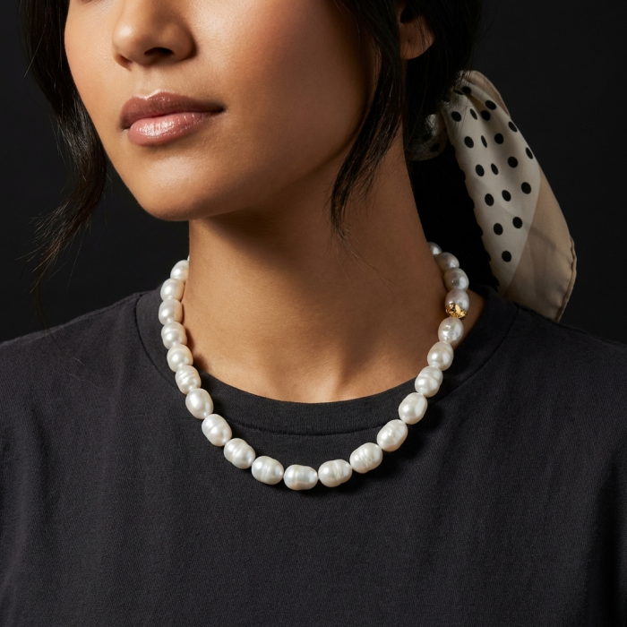 Baroque style 16 inches long Freshwater Pearl 10K Gold over .925 Sterling Silver handmade Necklace - Pearl necklace worn on neck, close-up side view with gold detail.