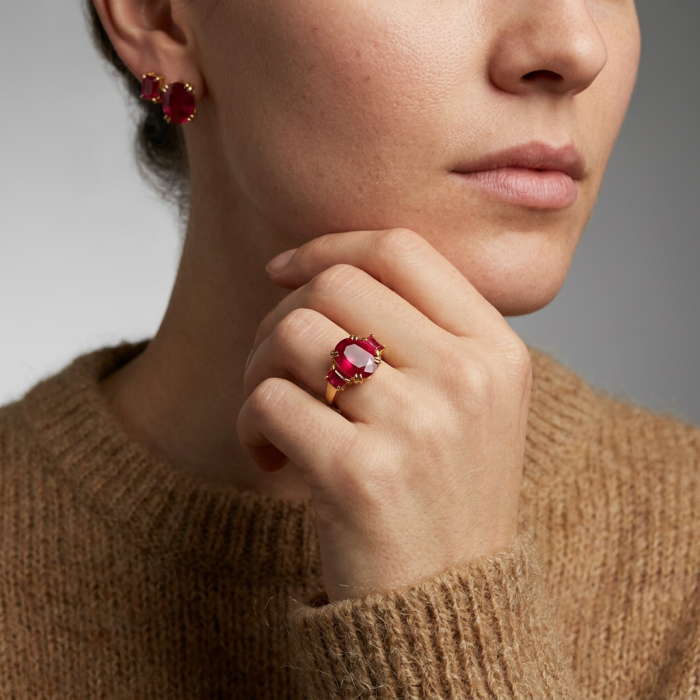 Bella Rosa Genuine 9.8 carat Kasmir Ruby .925 Sterling Silver dipped in 22K Gold Statement Ring size 6 - Ruby ring and earrings worn on hand and ear, close-up view.