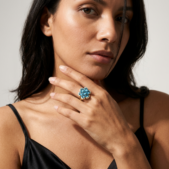 Forget-Me-Not Authentic 18.7 carat Swiss Blue Topaz white Enamel .925 Sterling Silver dipped in 22K Gold handcrafted Large ring size 7 3/4 - Woman wearing ring with Swiss Blue Topaz in flower design