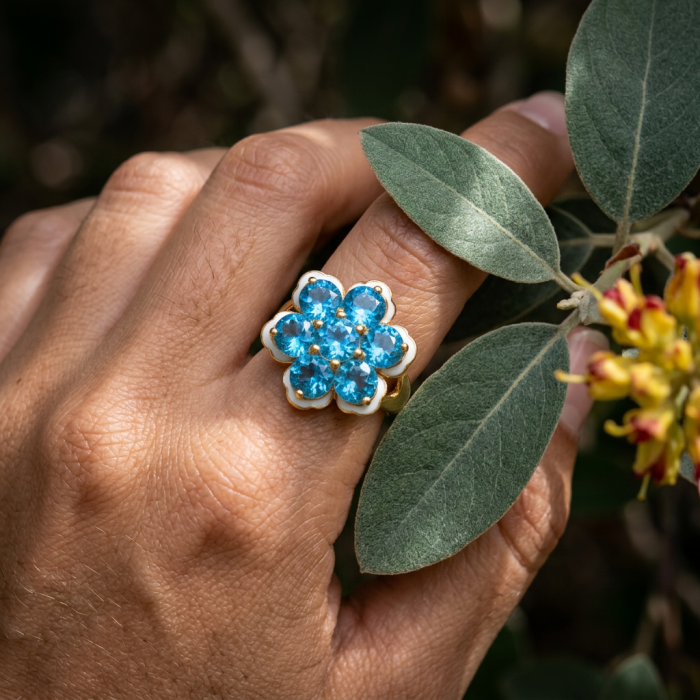 Forget-Me-Not Authentic 18.7 carat Swiss Blue Topaz white Enamel .925 Sterling Silver dipped in 22K Gold handcrafted Large ring size 7 3/4 - Forget-Me-Not Swiss Blue Topaz ring worn on hand, top view with leaves.