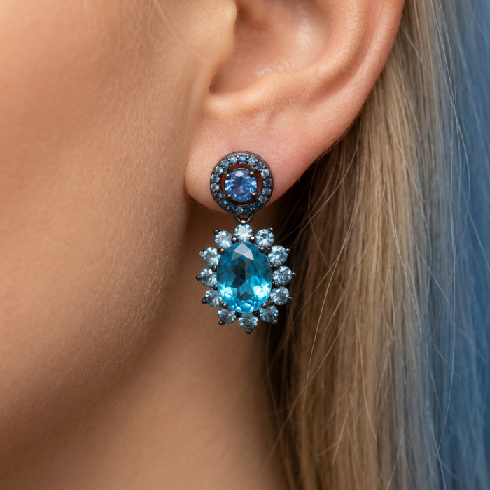 Atlantica 10.7 carat Swiss Blue Topaz .925 Sterling Silver dipped in black rhodium Handcrafted Statement earrings - Close-up of Atlantica Swiss Blue Topaz earring on ear.