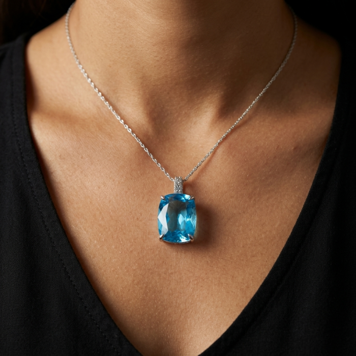 Pacifica 19.5 carat Swiss Blue Topaz .925 Sterling Silver Handcrafted necklace - Swiss Blue Topaz pendant on a neck, front view, sterling silver chain.