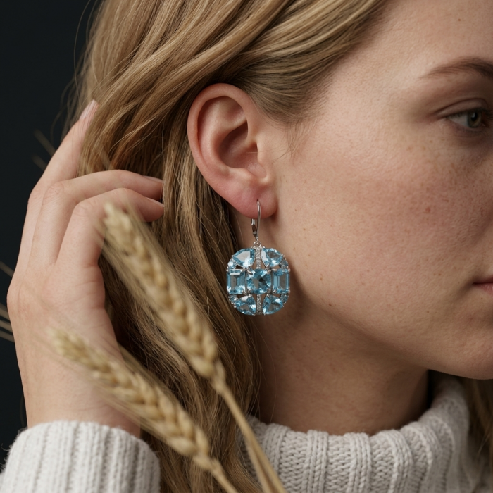 Atlantica 33.7 carat Swiss Blue Topaz .925 Sterling Silver Handcrafted Statement earrings - Side view of blue topaz earring worn on ear