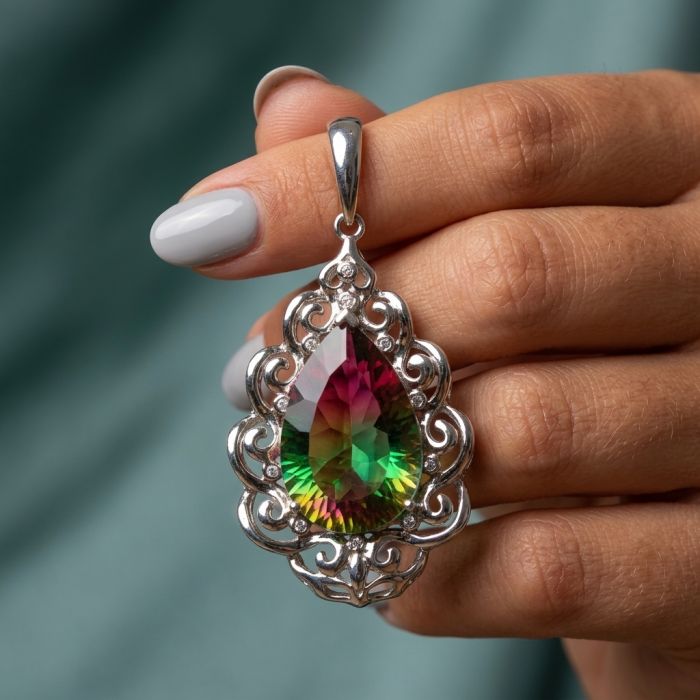 25.2 carat pear cut Brazilian Tourmaline .925 Sterling Silver Perfectly handcrafted pendant - Close-up of 25.2 carat tourmaline pendant in hand