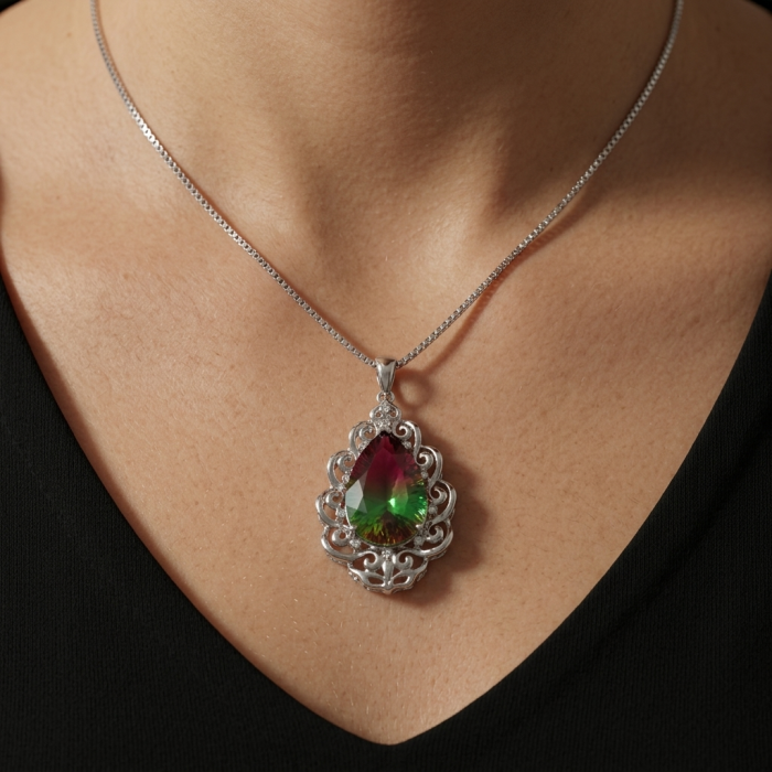 25.2 carat pear cut Brazilian Tourmaline .925 Sterling Silver Perfectly handcrafted pendant - Tourmaline pendant in ornate setting on neck, front view.