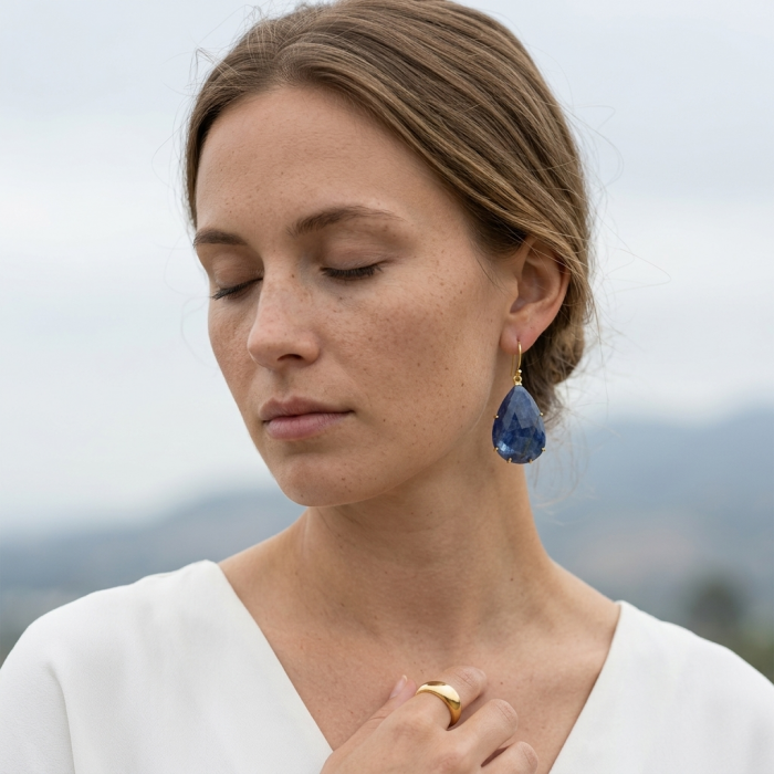 Giovanna - Authentic oval cut 27.9 carat faceted SAPPHIRE .925 Sterling Silver handcrafted earrings - Woman wearing large sapphire earring, side view