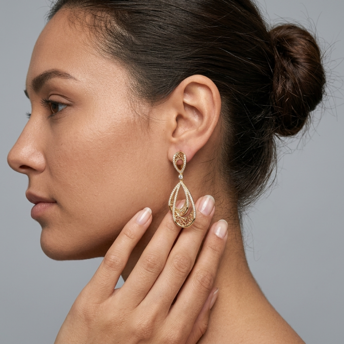 Black Label Collection - Dubai Style - Natural 22K Gold over .925 Sterling Silver handmade earrings - Side view of woman wearing gold drop earring from Black Label Collection.
