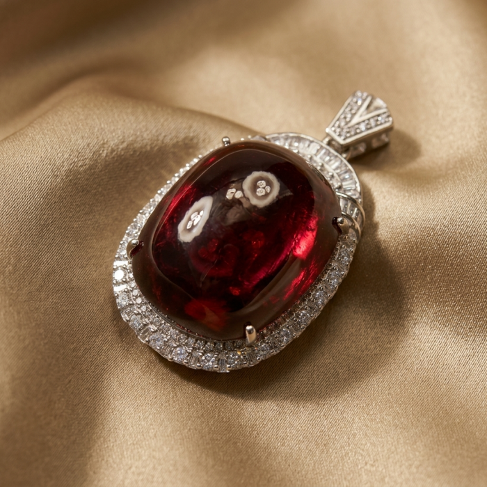Rare finding! Deluxe 47.2 carat authentic Kashmir Ruby rhodium over .925 Sterling Silver handmade Statement Pendant - Close-up of deluxe 47.2 carat Kashmir ruby pendant on satin fabric.