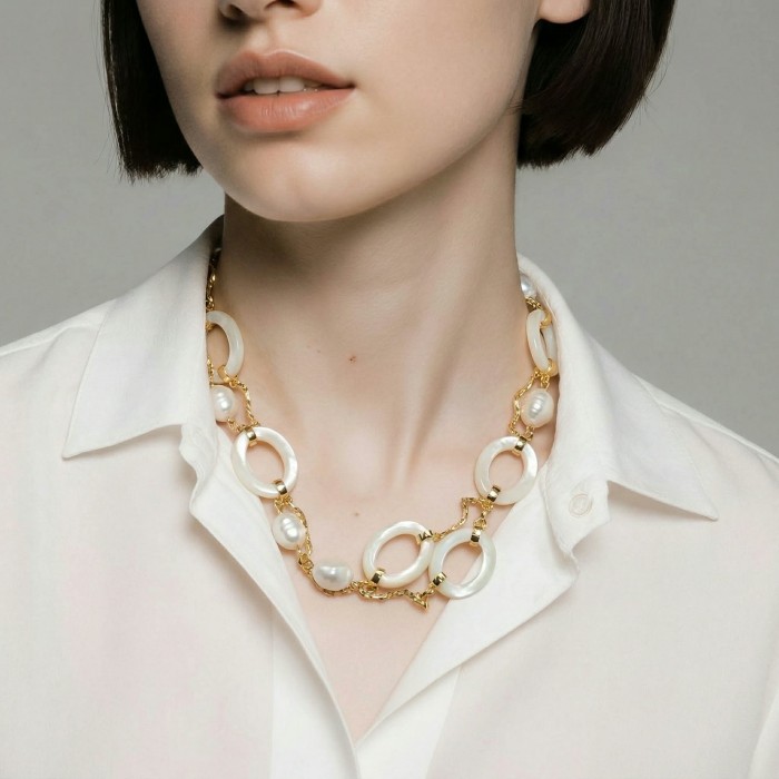 Precious White Blister Pearl 4K Gold over .925 Sterling Silver .925 Sterling Silver Necklace - Precious White Blister Pearl Necklace worn, front view on a white shirt.