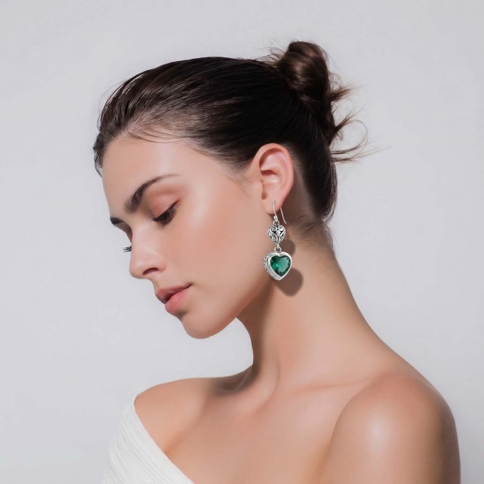 Green Heart Authentic 6.5 CARAT Chrome Diopside .925 Sterling Silver handcrafted earrings - Side view of green heart chrome diopside earrings worn by a model.