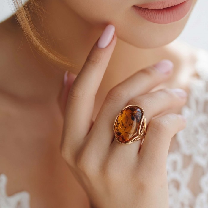 Authentic Baltic Amber 14K Gold over .925 Sterling Silver handcrafted ring; s. 7 adjustable - Amber ring on hand, close-up, 14K gold over sterling silver.