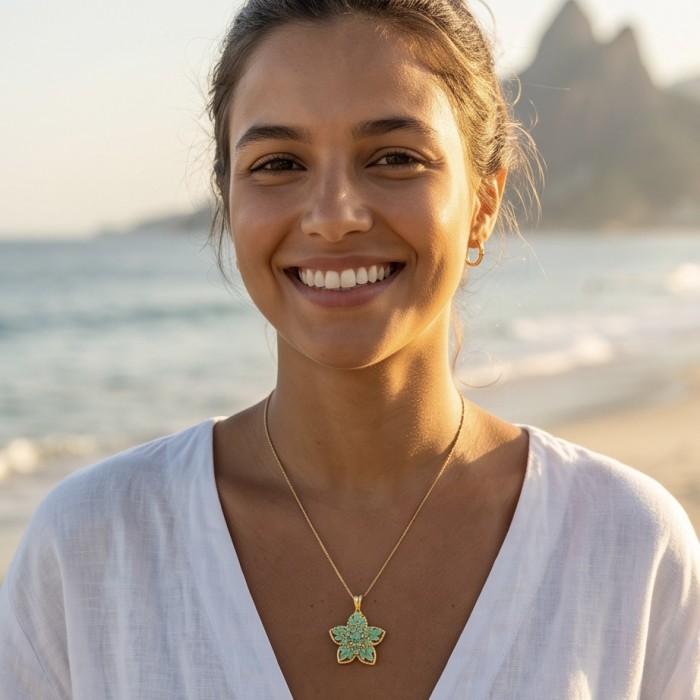 Floral design - authentic 25.5 carat Colombian Emerald 18K Gold over .925 Sterling Silver handcrafted Pendant - Emerald floral necklace worn on person at the beach, frontal view