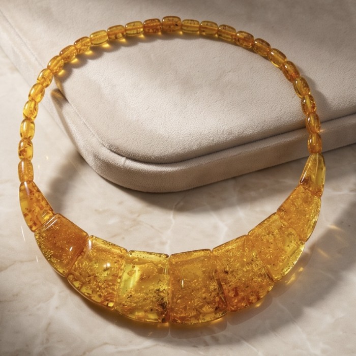 Dazzling - Rare!- vintage Style- natural Golden Baltic Amber .925 Sterling Silver handcrafted necklace - Amber necklace on marble surface with close-up of beads.