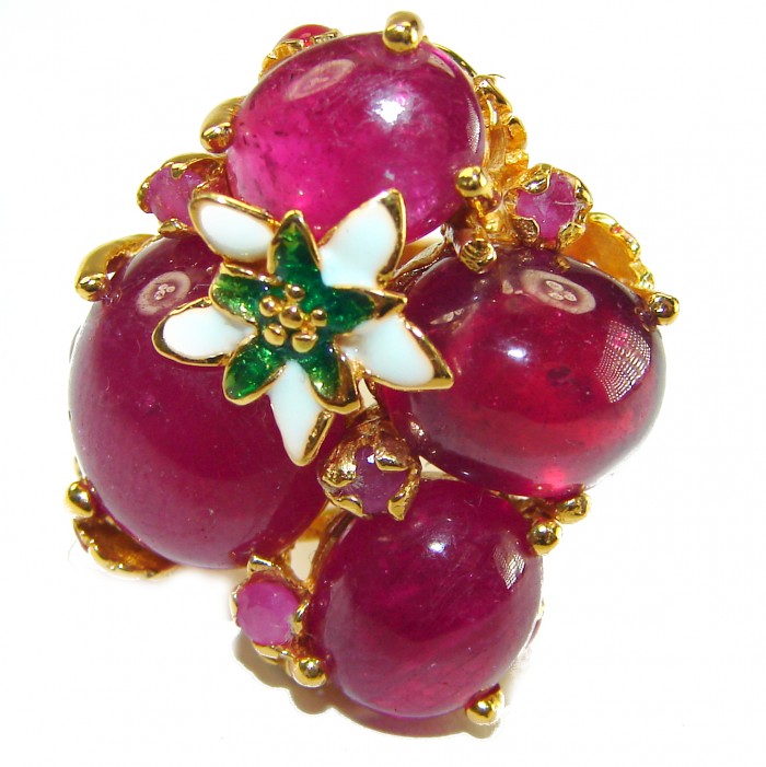 Sunrise Ruby - Natural 28.4 carat Ruby 18K Gold over .925 Sterling Silver handmade Large Statement Ring size 6 - Close-up of Sunrise Ruby ring with flower accent, gold setting visible.
