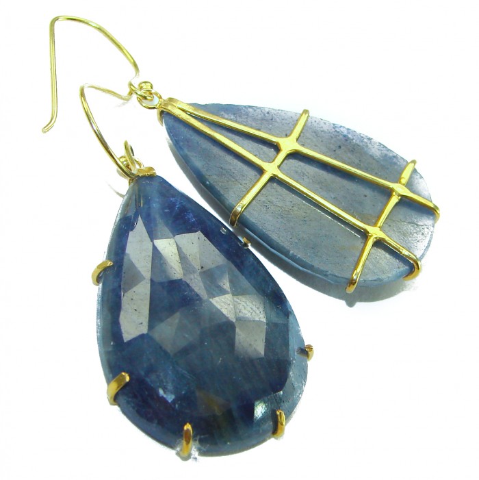 Giovanna - Authentic oval cut 27.9 carat faceted SAPPHIRE .925 Sterling Silver handcrafted earrings - Close-up of faceted sapphire earrings with gold prong settings.