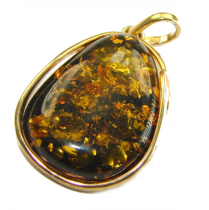 Prehistoric cognac Authentic Baltic Amber 14K Gold over.925 Sterling Silver beautifully handcrafted Pendant - Amber pendant with gold setting, angled view, close-up of inclusions.