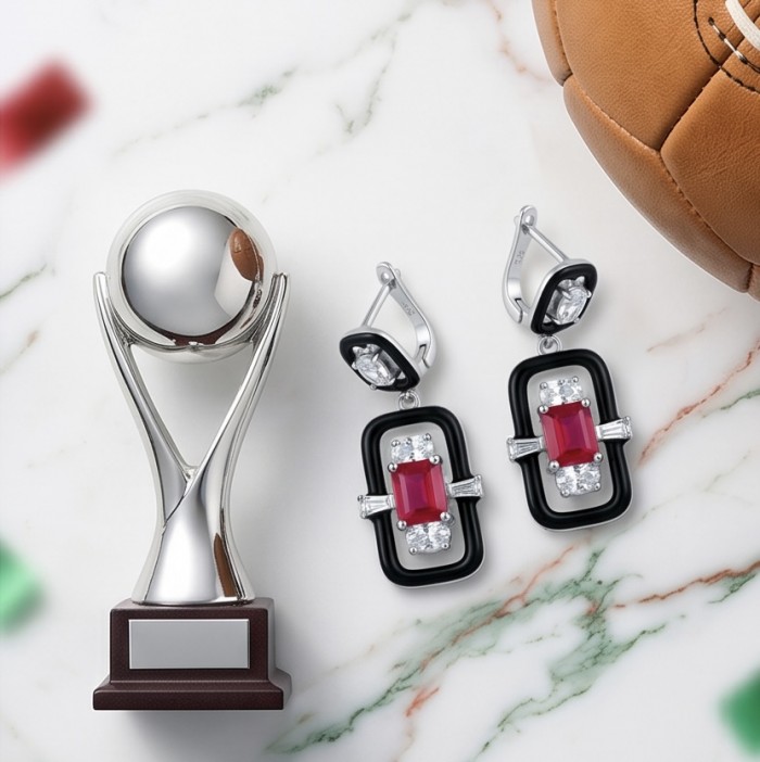 Art Deco - 4.5 carat Ruby enamel .925 Sterling Silver handcrafted incredible earrings - Earrings on marble background with trophy and football.