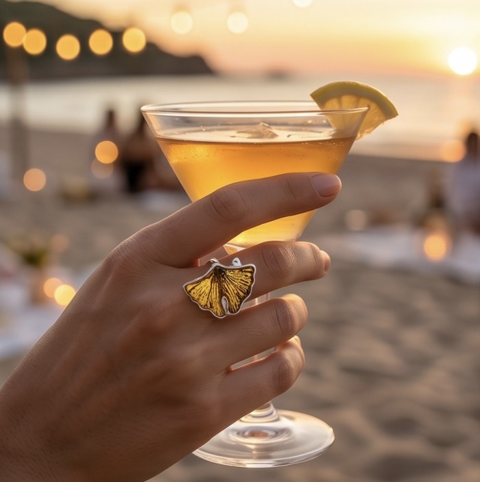 Calla lily Authentic Golden carved Baltic Amber .925 Sterling Silver entirely handcrafted LARGE ring; s. 7 adjustable - Ring with calla lily amber design worn on hand, beach sunset in background.