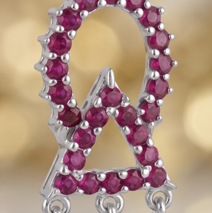 Precious - Art Deco 8.2 carat Ruby rhodium over .925 Sterling Silver handmade earrings - Close-up of ruby-studded sterling silver pendant with chain loops.
