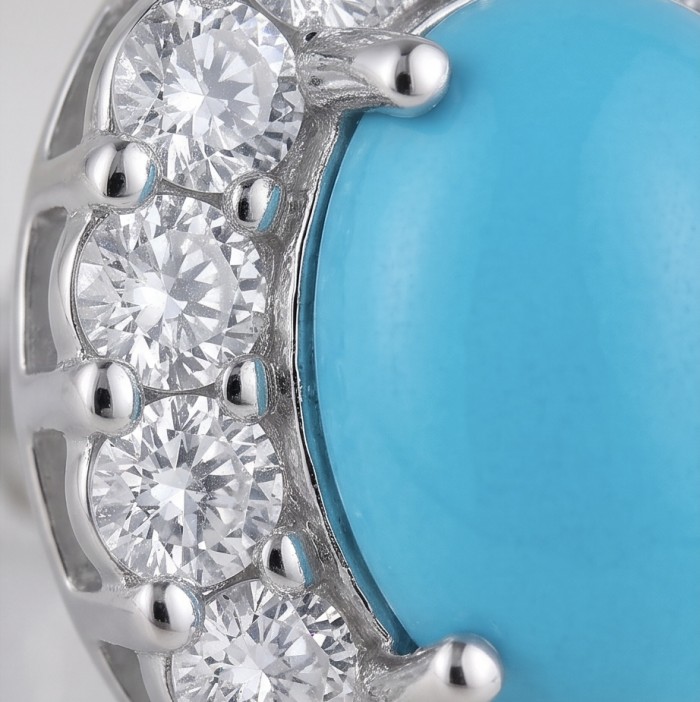 Blue Dreamland - Luxurious stabilized Turquoise .925 Sterling Silver handcrafted Earrings - Close-up of blue turquoise and diamonds on sterling silver jewelry.