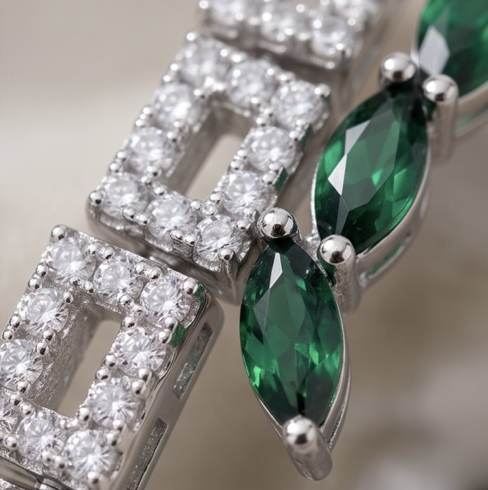 Precious 4.2 carat natural Colombian Emerald rhodium over .925 Sterling Silver handcrafted bracelet - Close-up of emerald and diamond accents in rhodium setting.