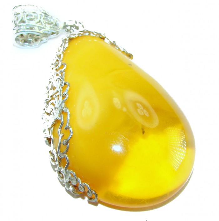 Prehistoric Butterscotch Authentic Baltic Amber .925 Sterling Silver beautifully handcrafted Pendant - Close-up of butterscotch amber pendant with silver filigree detailing