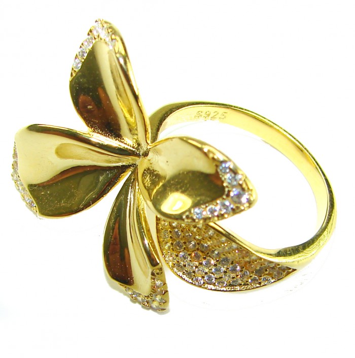 Lotus flower White Topaz highly polished 18K Gold over .925 Sterling Silver Italy made ring s. 7 adjustable - Gold lotus flower ring with white topaz, side angle close-up.