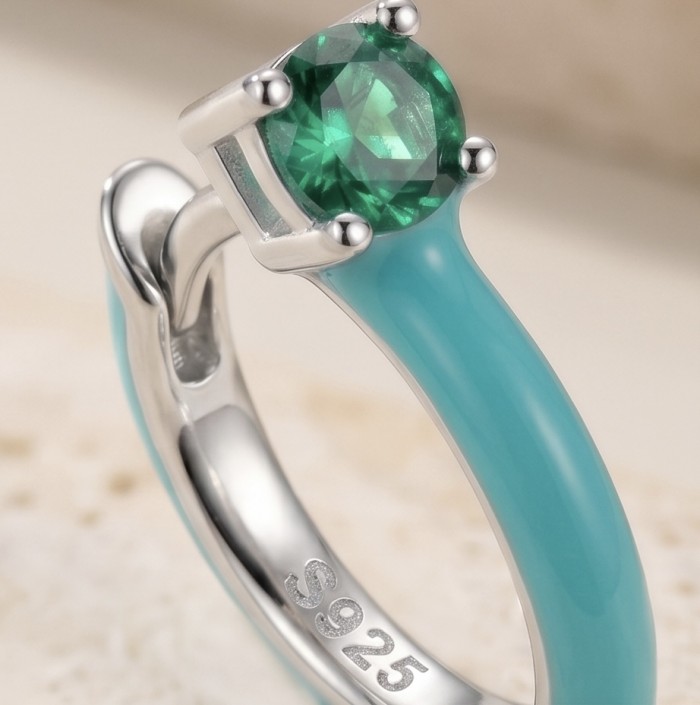 0.5 carat Emerald enamel .925 Sterling Silver handcrafted hoop earrings - Emerald ring close-up, enamel band, .925 sterling silver marking visible.