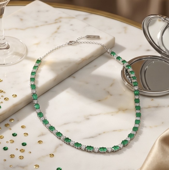 Art Deco 12.4 carat Emerald .925 Sterling Silver handcrafted Statement necklace - Art Deco Emerald Sterling Silver Necklace on marble background, top view