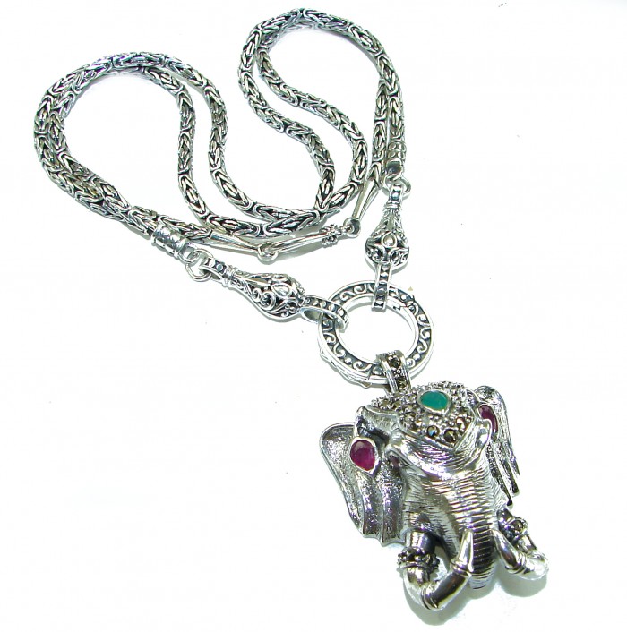 Luck and Prosperity HUGE 55.5 grams ELEPHANT genuine EMERALD .925 Sterling Silver handcrafted Necklace - Elephant pendant necklace with emerald, angled view, intricate design.
