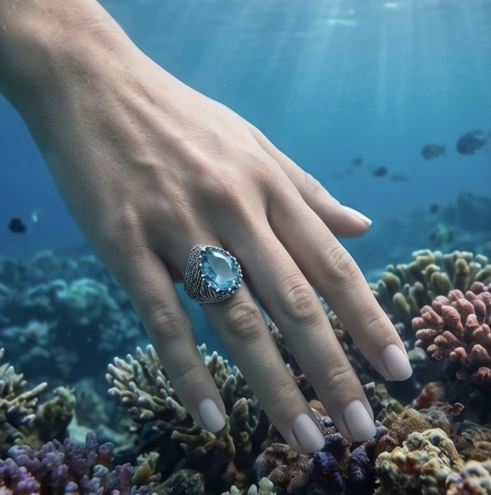 Massive Deep Blue 18.8 carat Aquamarine .925 Sterling Silver handcrafted ring size 7 - Aquamarine ring worn on hand, underwater coral background.