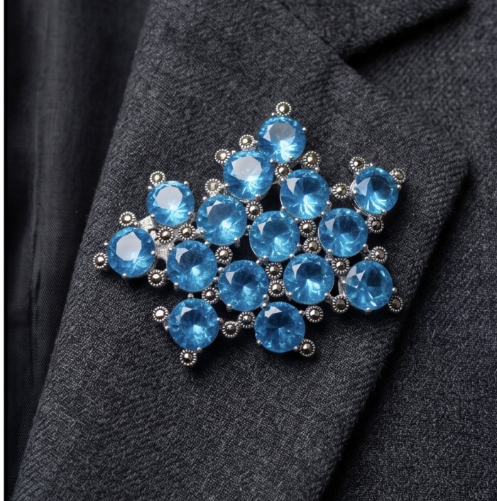 Blue Sky Authentic 45.5 carat Swiss Blue Topaz .925 Sterling Silver DIPPED IN RHODIUM handmade LARGE Pendant - Brooch - Blue topaz brooch on suit lapel, showcasing stones and metal setting.