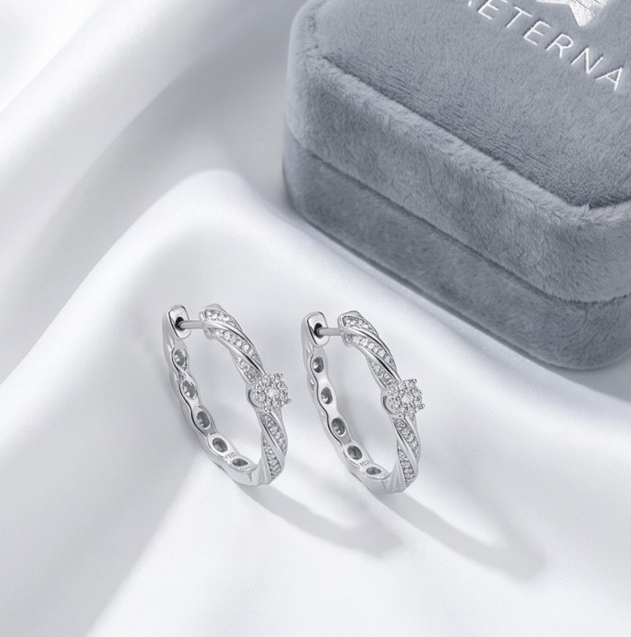 Elizabeth Natural 1.2 carat White Topaz .925 Sterling Silver handcrafted earrings - Silver hoop earrings on fabric, box beside, angled top view.