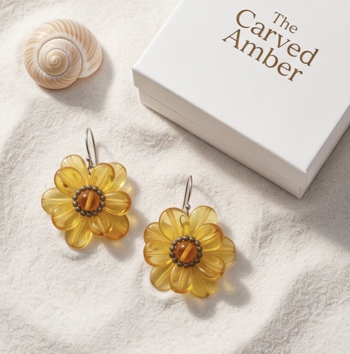 Summer Flowers Wonderful natural Baltic Amber .925 Sterling Silver entirely handcrafted earrings - Amber flower earrings on sand with gift box and shell, top view.