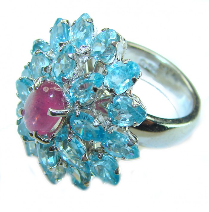 Magnificent Jewel 58.5 carat Ruby Swiss Blue Topaz .925 Sterling Silver handcrafted incredible Cocktail Ring s. 7 1/4 - Ring close-up with blue topaz and ruby stone, silver band detail.