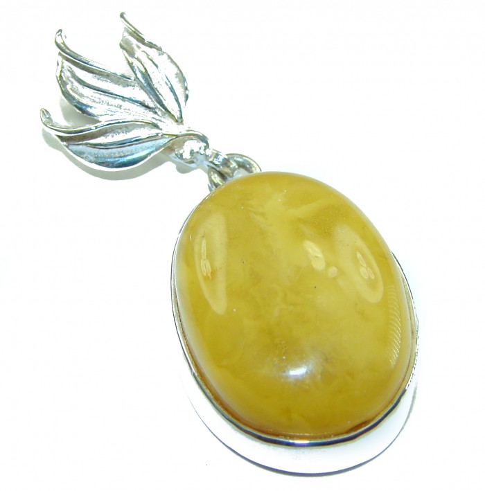 Prehistoric Authentic Buttescotch Baltic Amber 14K Gold over .925 Sterling Silver beautifully handcrafted Pendant - Close-up of oval butterscotch Baltic amber pendant with silver leaf detail.