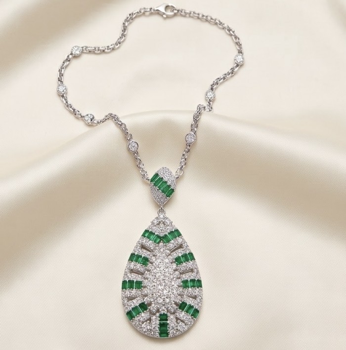 Art Deco - Royalty 10.2 carat Colombian Emerald .925 Sterling Silver .925 Sterling Silver Statement Necklace - Art Deco necklace with emeralds on satin background, front view.