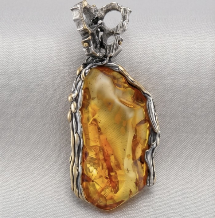 Massive Prehistoric Authentic Golden Baltic Amber rhodium over .925 Sterling Silver beautifully handcrafted Pendant - Close-up of massive golden Baltic amber pendant with rhodium overlay.