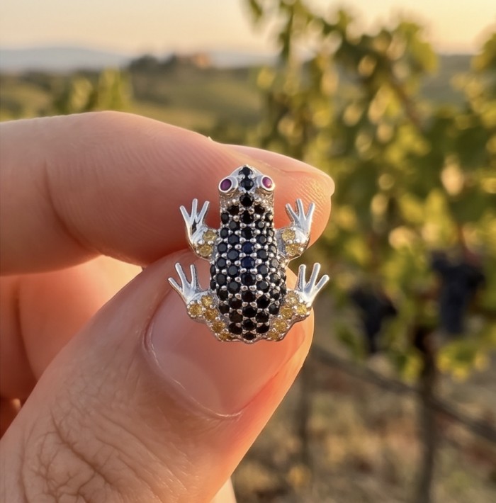 Large Blue Frogs 4.2 carat Sapphire rhodium over .925 Sterling Silver handcrafted earrings - Close-up of large sapphire frog jewelry held between fingers.
