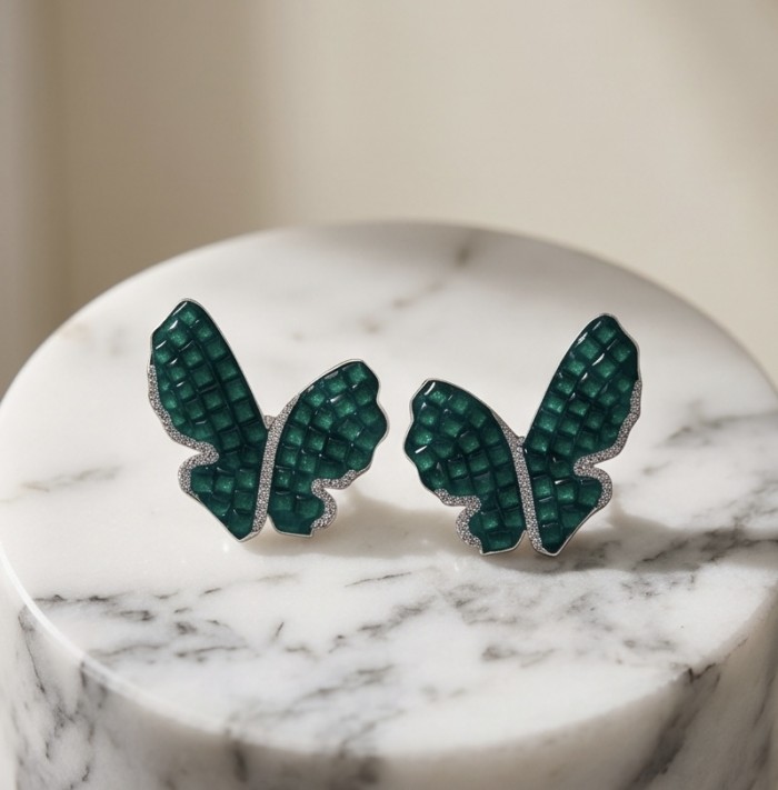 Incredible Butterflies genuine mystery setting 15.5 CARAT Emerald .925 Sterling Silver handcrafted Earrings - Close-up of butterfly earrings with emerald green mystery setting