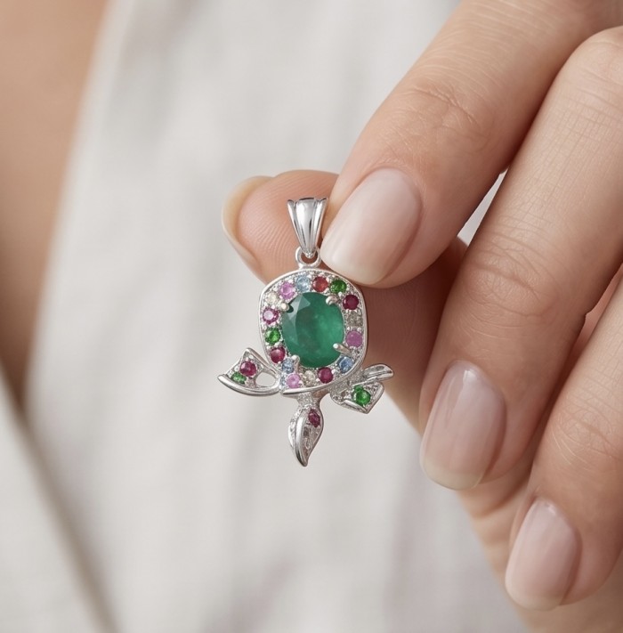 Stella - Very Unique authentic 4.9 carat Jade .925 Sterling Silver handcrafted pendant - Close-up of jade pendant in hand, featuring colorful gemstone details.