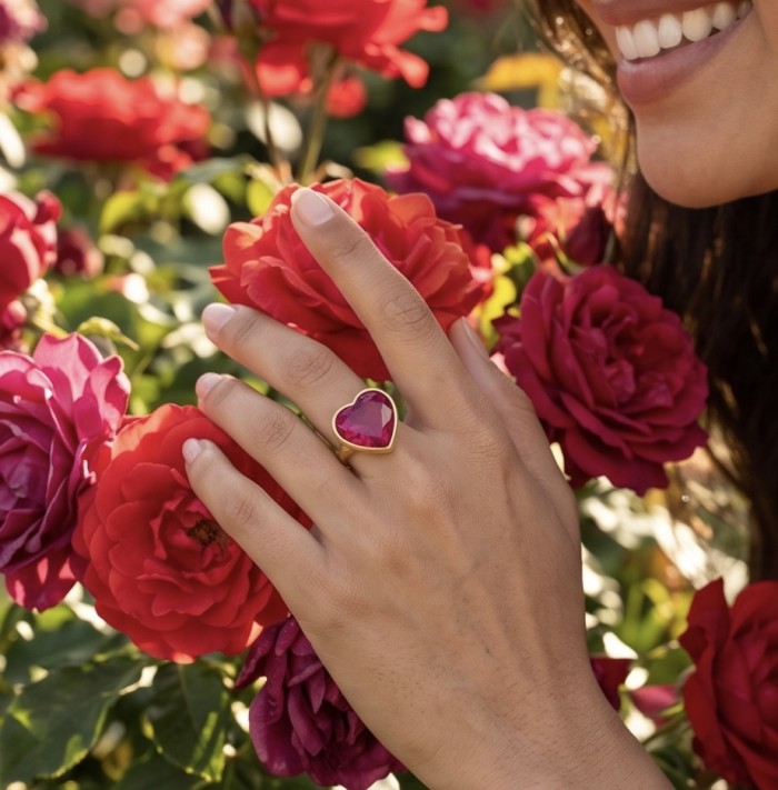 Angel's Heart Natural heart shape 18.7 carat Ruby .925 Sterling Silver dipped in 22K Gold handmade Statement Ring size 6 1/4 - Worn on hand, heart-shaped ruby ring amidst red roses.
