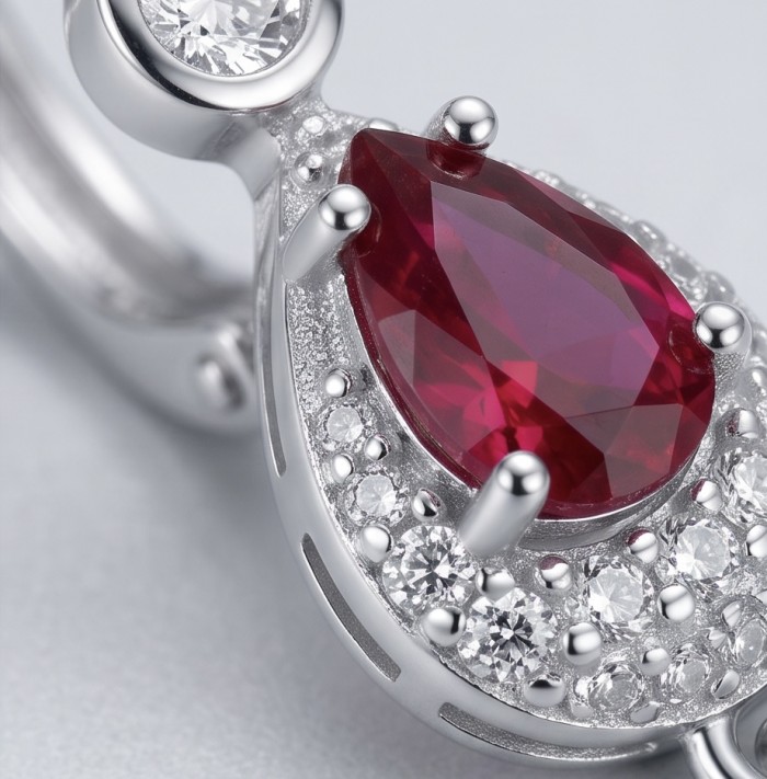 Genuine 3.8 carat Ruby rhodium over .925 Sterling Silver handcrafted Statement Earrings - Ruby and diamond close-up on rhodium over sterling silver setting.