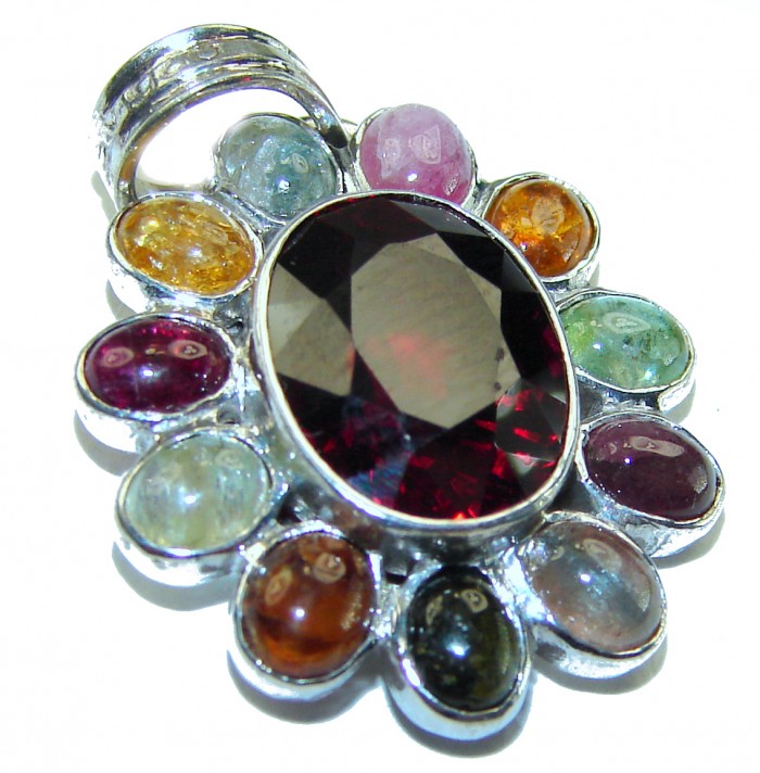 Authentic 8.5 carat Ruby Tourmaline .925 Sterling Silver handcrafted Pendant - Pendant with ruby and colorful gems close-up on white background