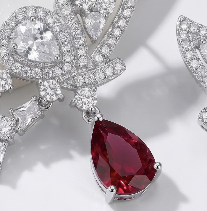 Giovanna - Magnificent Jewel 4.5 carat Ruby .925 Sterling Silver handcrafted incredible earrings - Close-up of ruby and diamond details on sterling silver jewelry.