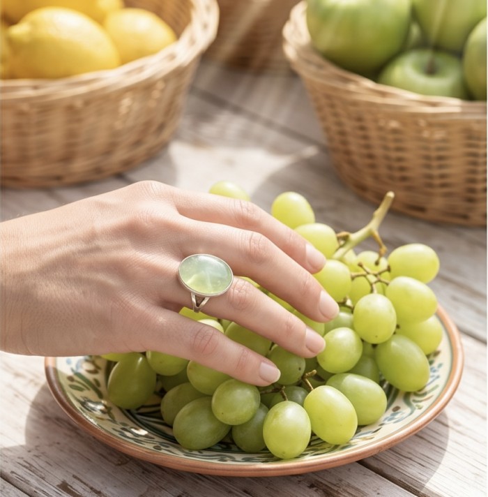 Outstanding LARGE 29.5 carat Natural Prehnite from Scotland .925 Sterling Silver handmade ring s. 9 1/2 - Prehnite ring worn on hand with grapes and fruit baskets in background.