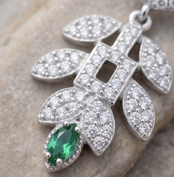Precious 2.2 carat natural Colombian Emerald rhodium over .925 Sterling Silver earrings - Close-up of Colombian Emerald pendant with diamond accents.