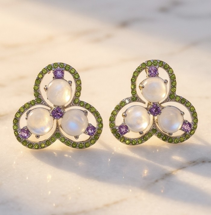 Cascades OF LIGHT Genuine 12.2 carat Fire Moonstone rhodium over .925 Silver handcrafted earrings - Earrings front view with moonstones, green and purple gemstones.